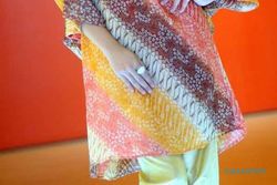 Tunik draperi dan cheongsam, pilihan trendi untuk Lebaran