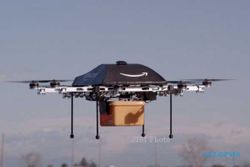 PESAWAT TANPA AWAK : Hebat, Amazon Bakal Kirimkan Barang Pakai Helikopter Robot!