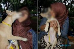 FOTO KONTROVERSIAL : Pamer Cium Anjing, Gadis Berjilbab Ini Tuai Kecaman