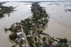 Penampakan Banjir Rendam Rumah dan Persawahan Warga di Bekasi